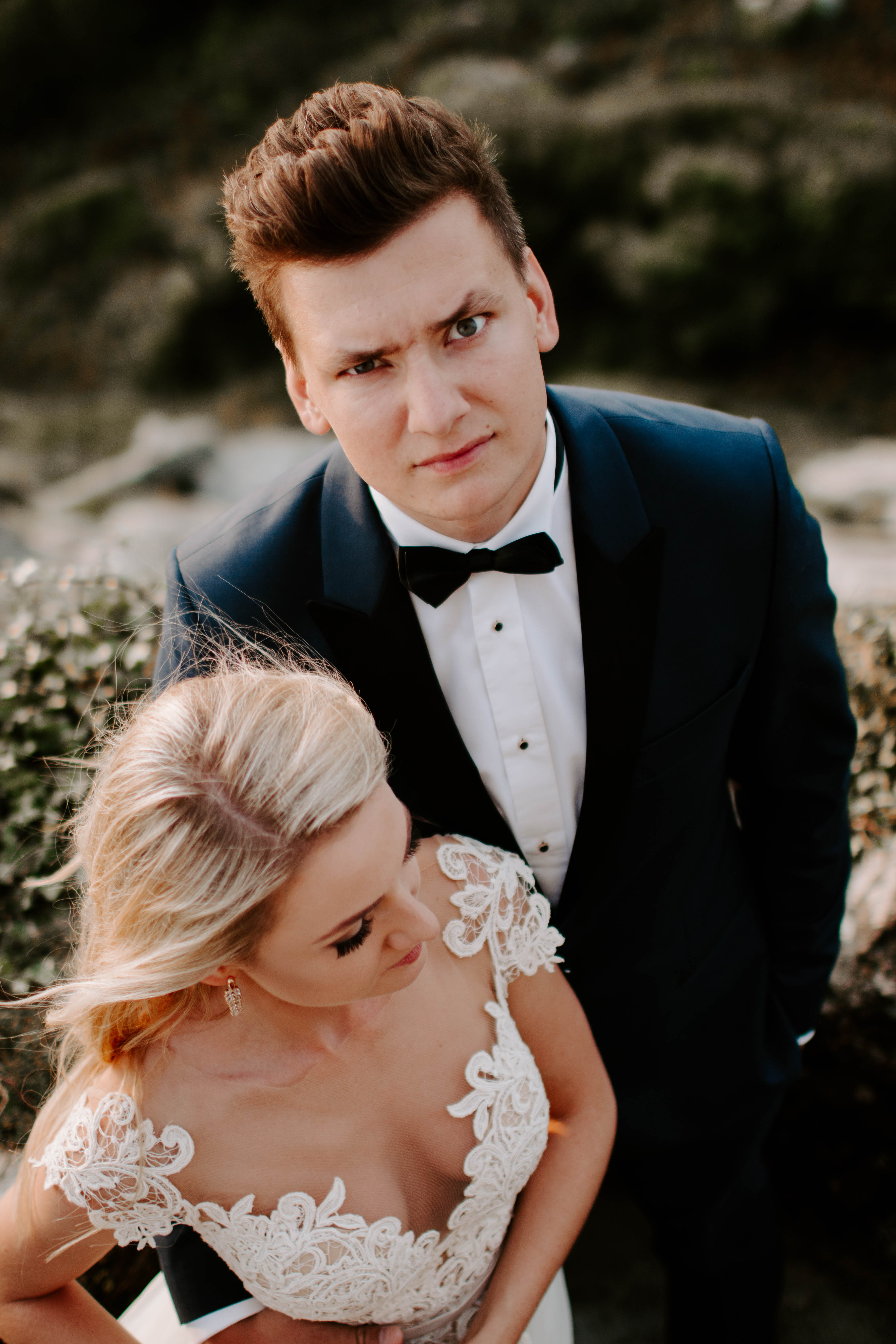 groom posing for a wedding portrait