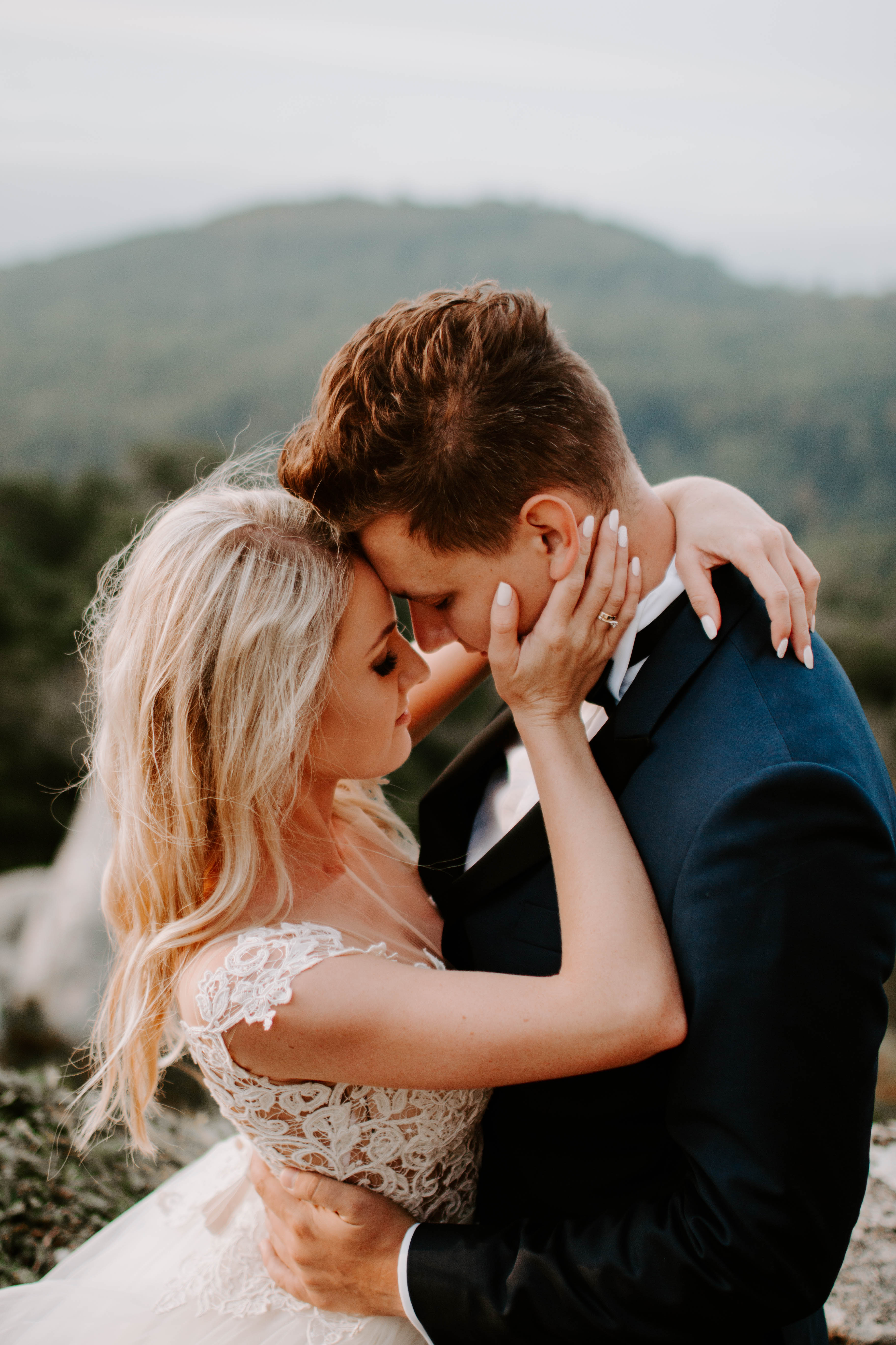 romantic photo of a bride and groom in the mountains