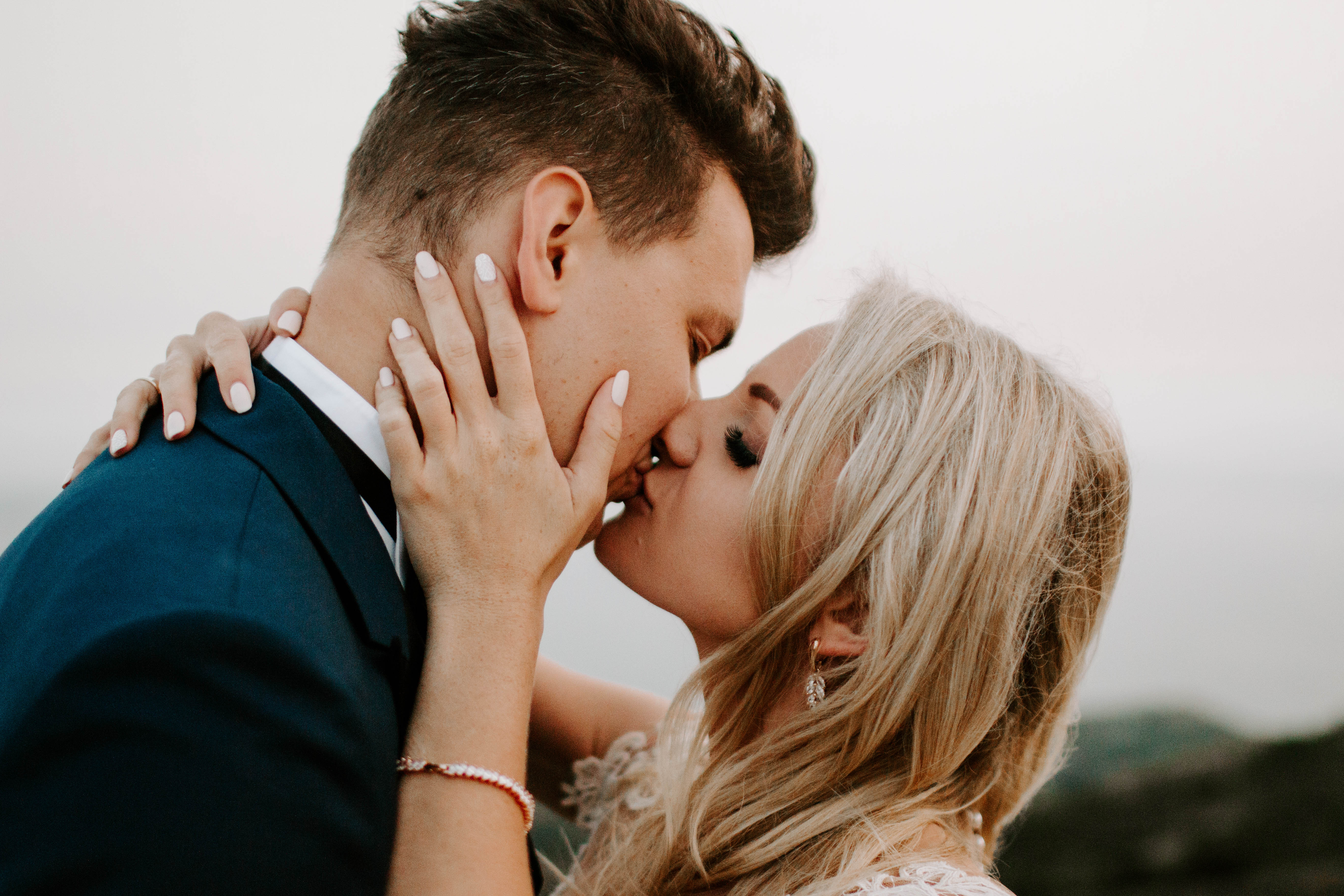 beautiful bride and groom kissing for wedding portrait