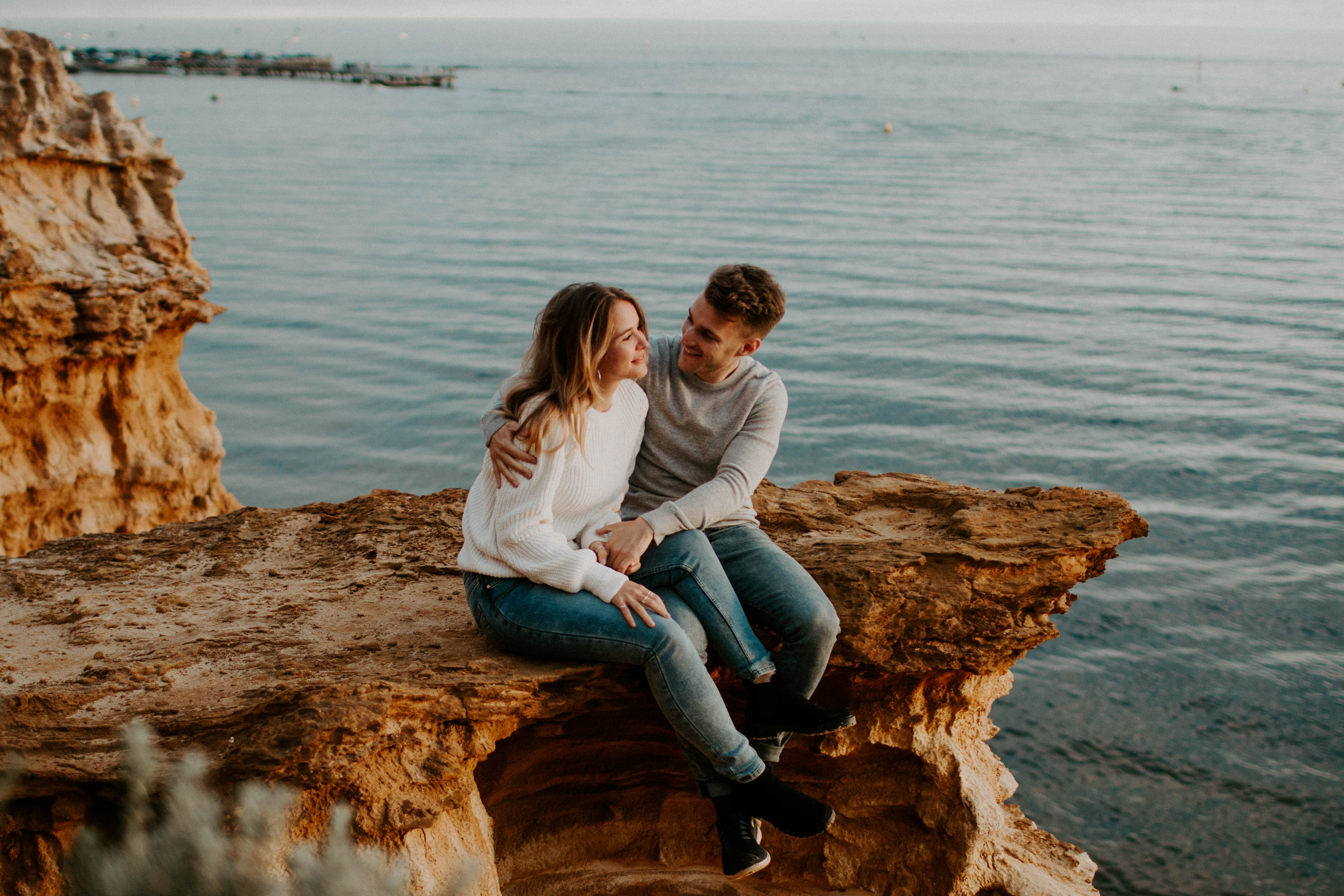 couple posing on a cliff in melbourne on a sunset