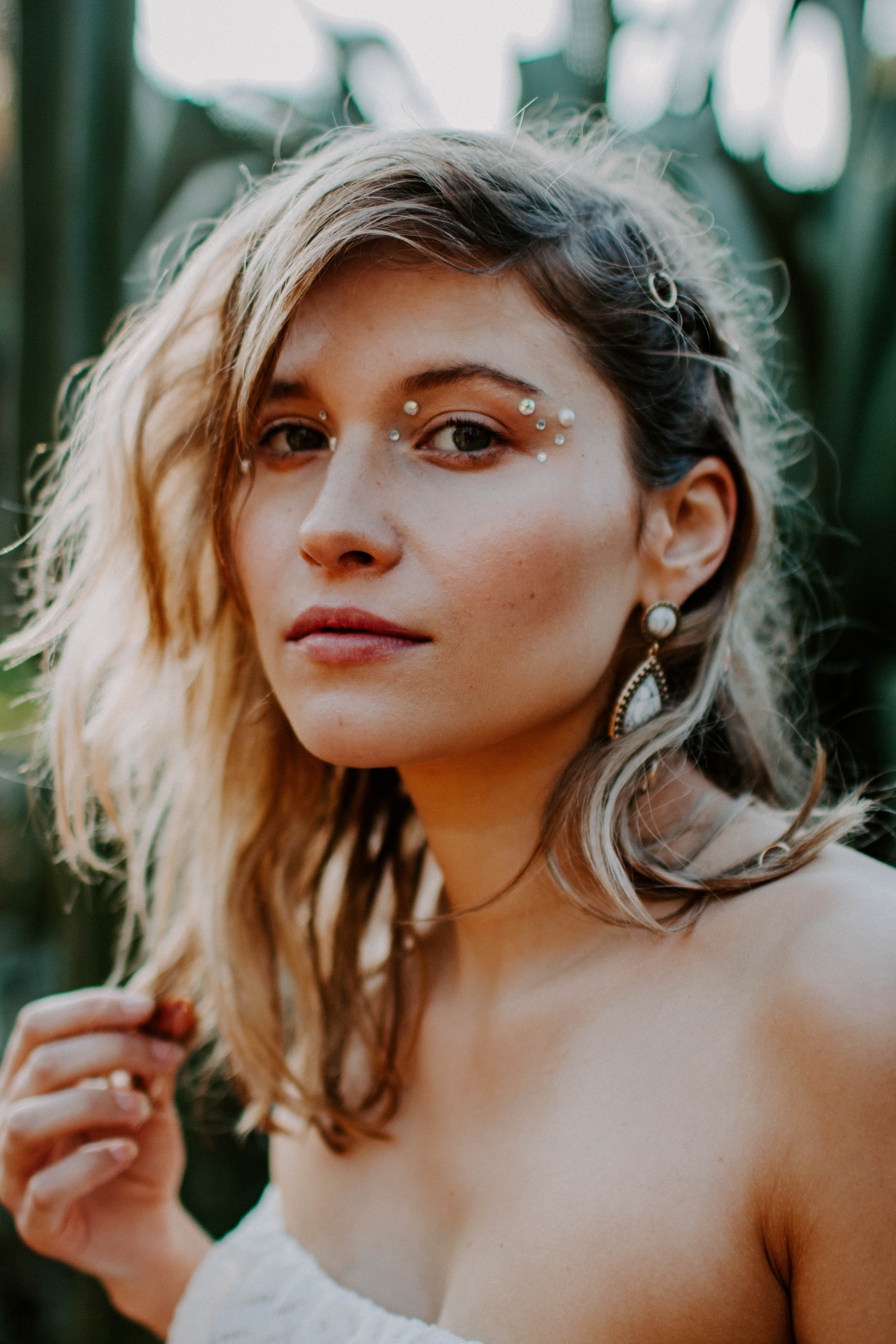 bridal portrait of a blonde girl with bohemian make-up and dress