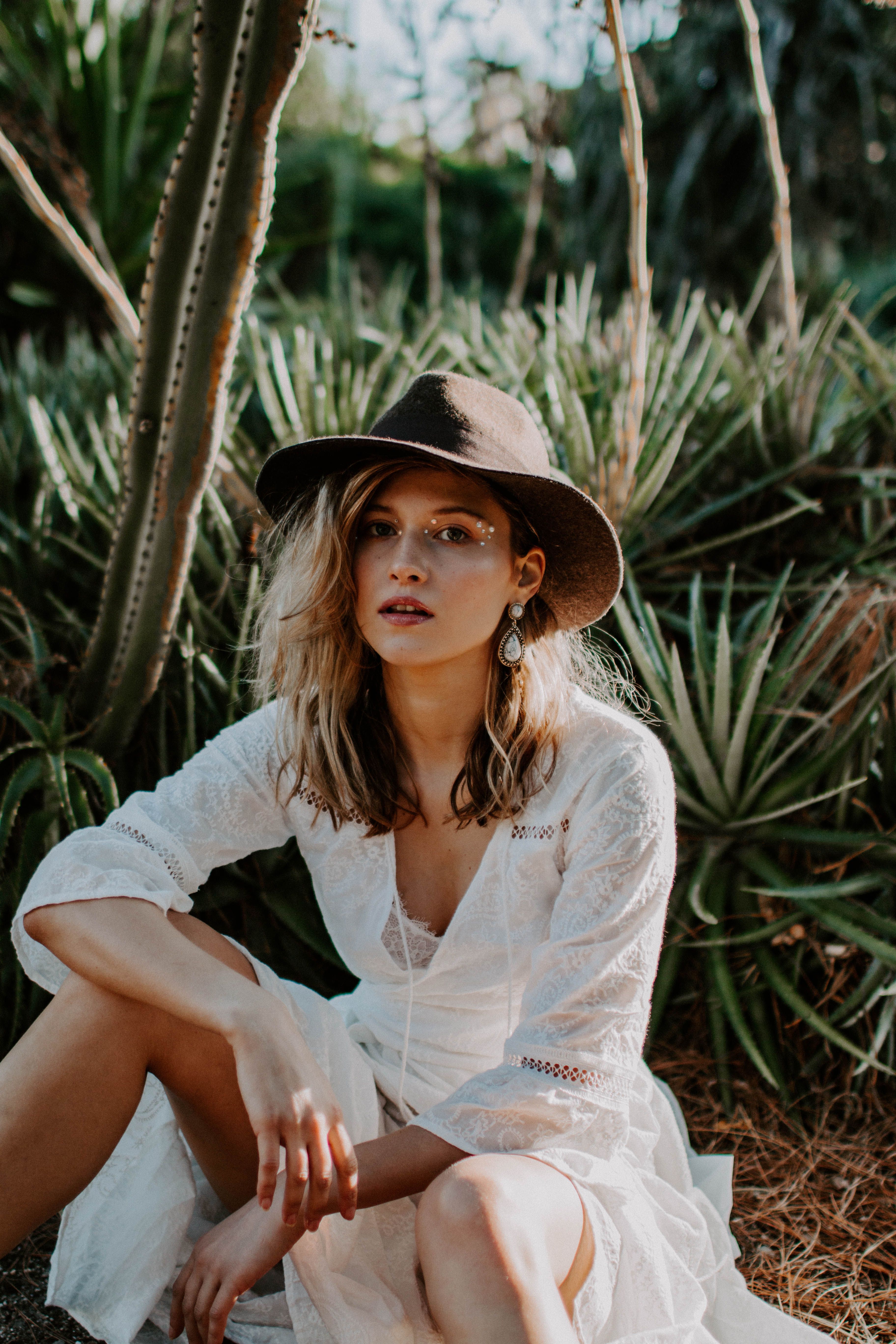 bohemian photoshoot with a girl wearing lace dress and hat