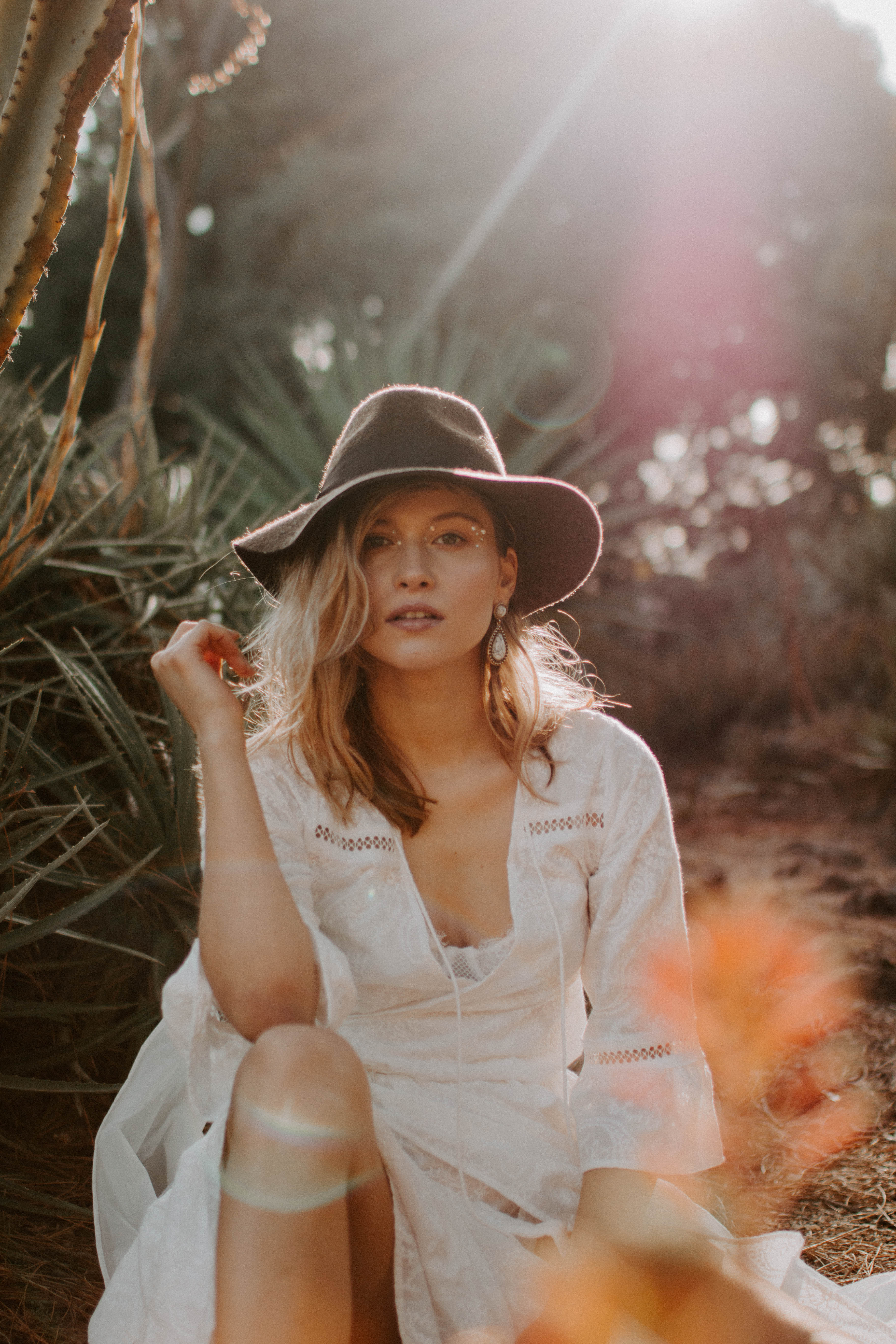 sunset photoshoot with cactuses with a girl wearing lace dress